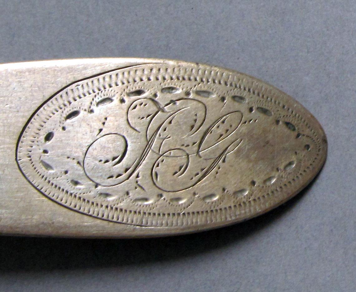 1962.0240.1212 Silver spoon engraving