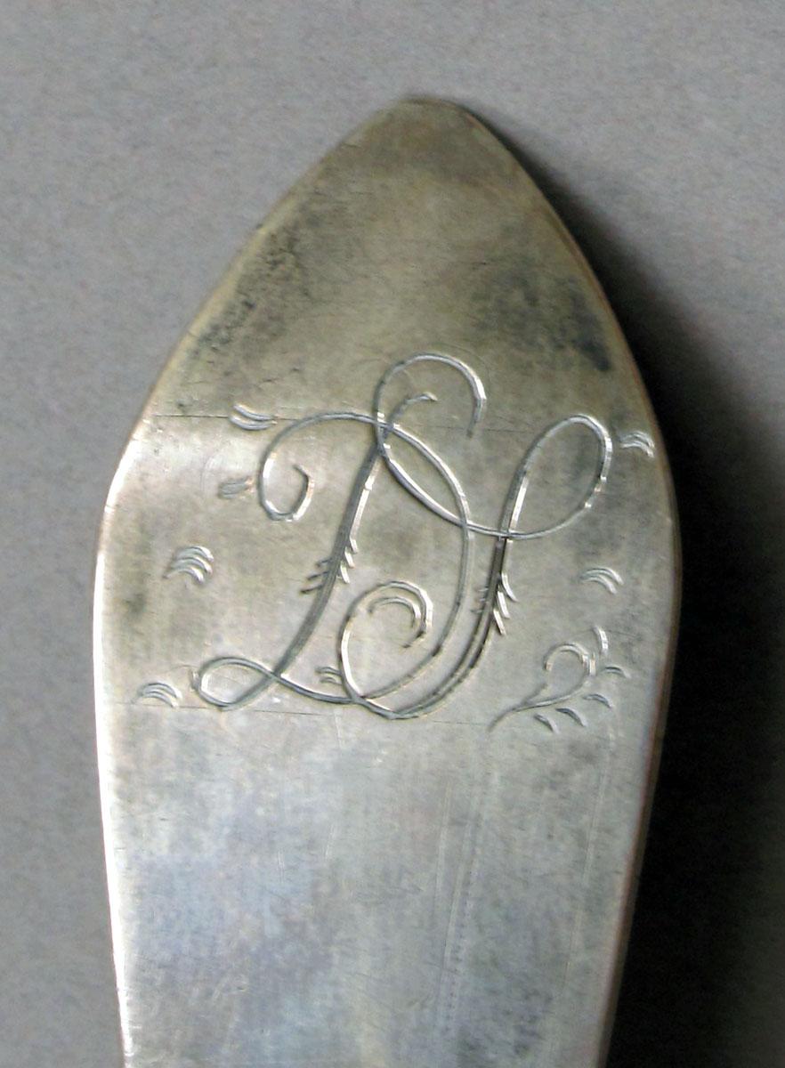 1962.0240.1228 Silver spoon engraving
