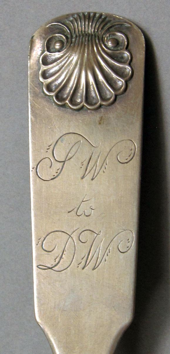 1962.0240.1232 Silver spoon engraving