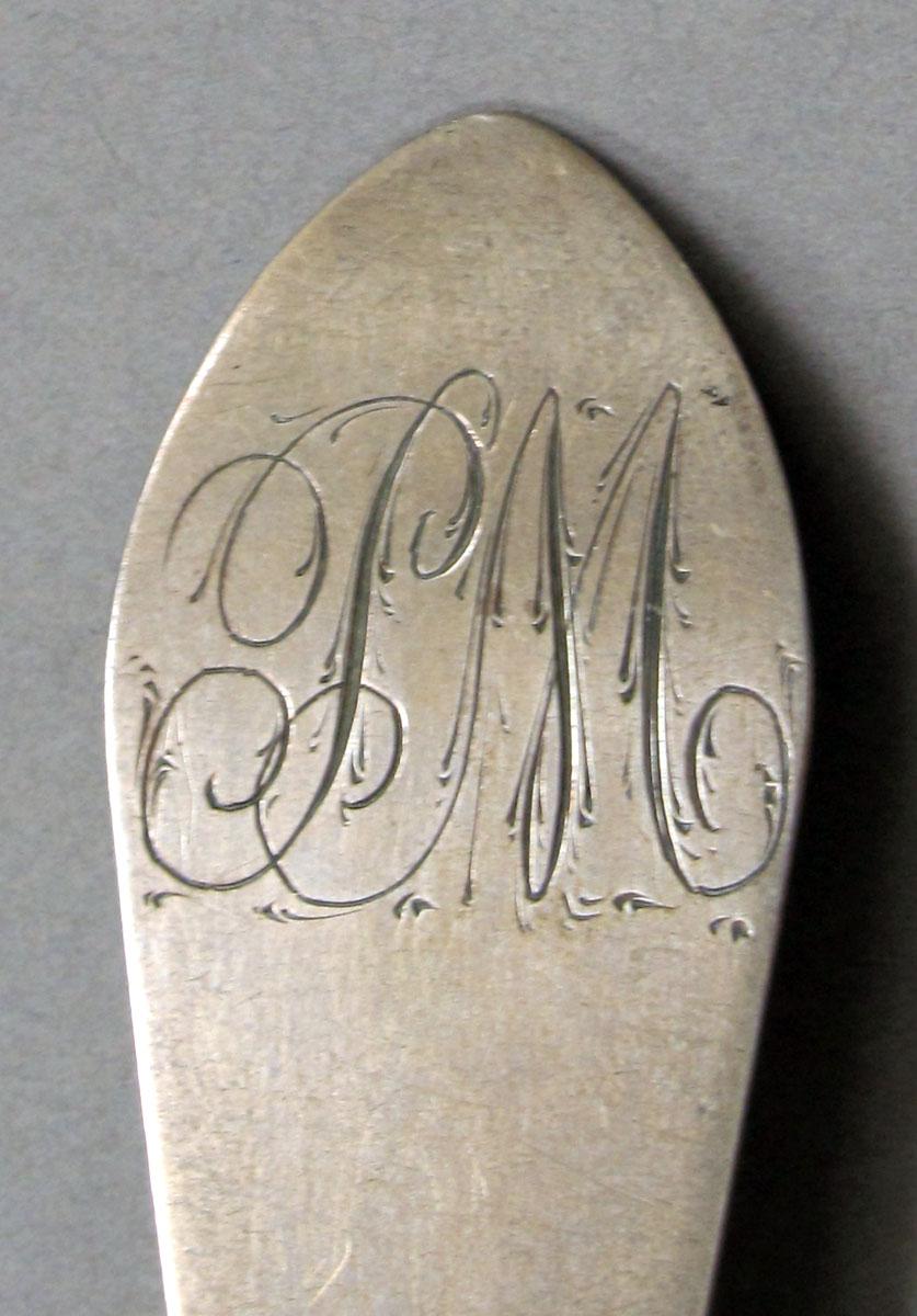 1962.0240.1233 Silver spoon engraving