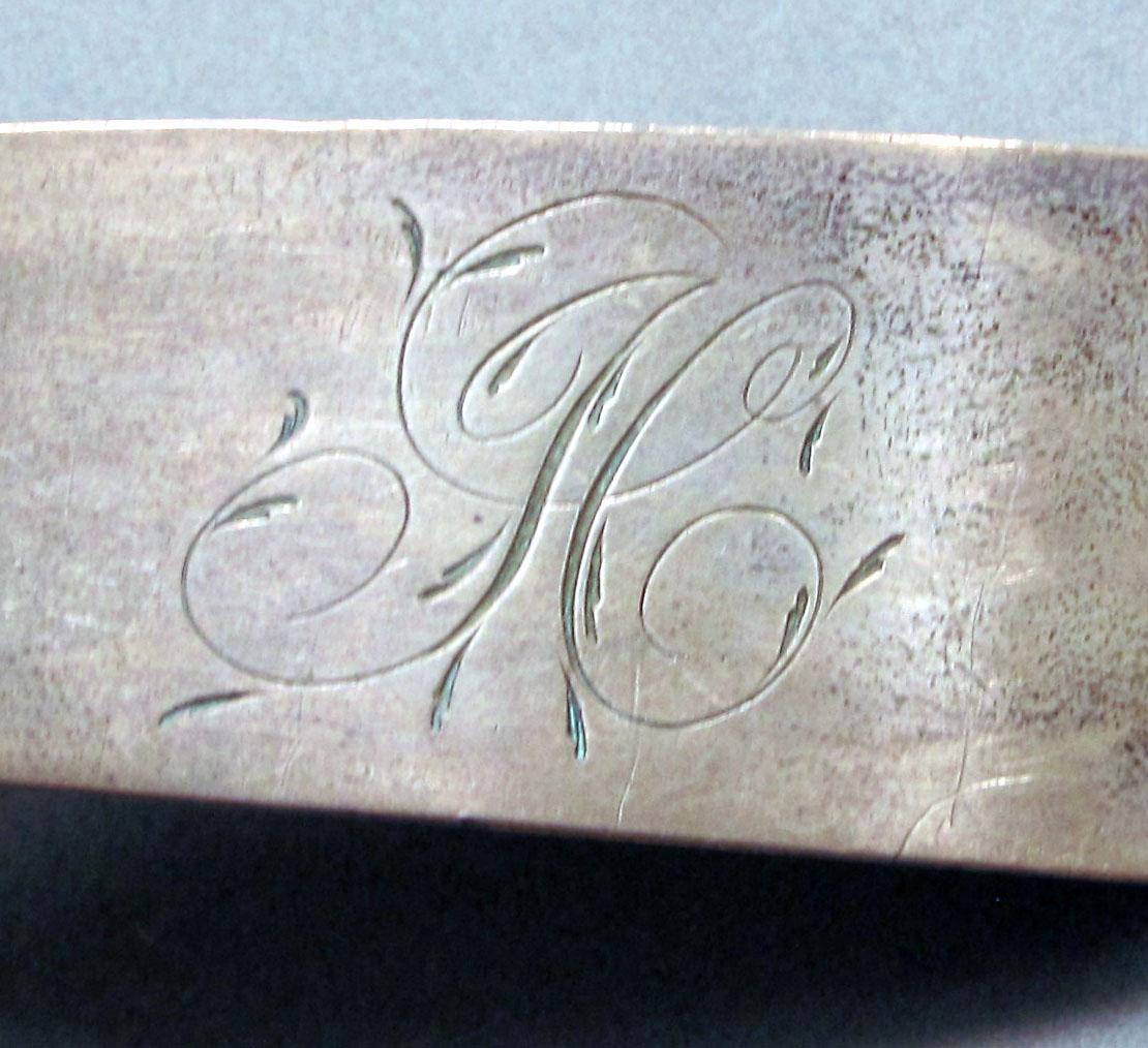 1962.0240.1242 Silver spoon engraving