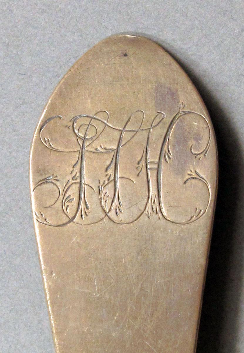 1962.0240.1253 Silver spoon engraving