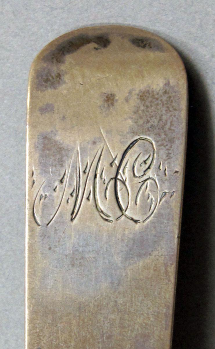 1962.0240.1254 Silver spoon engraving