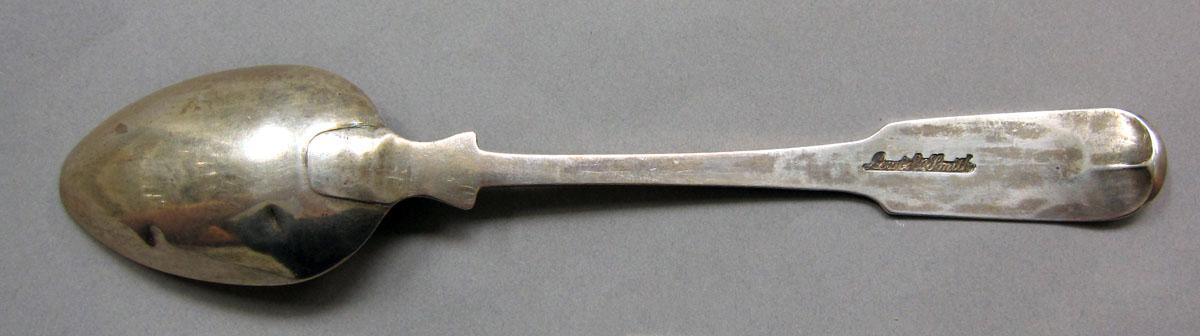 1962.0240.1255 Silver spoon underside