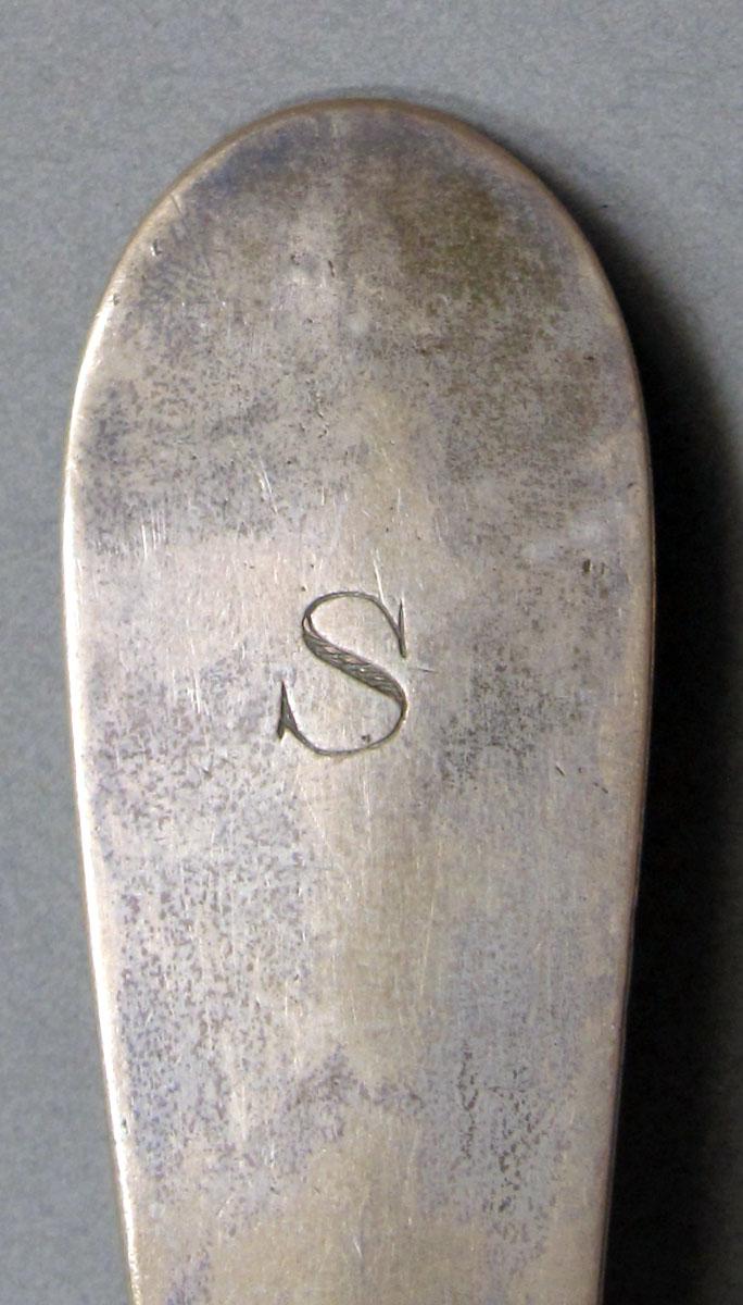 1962.0240.1256 Silver spoon engraving