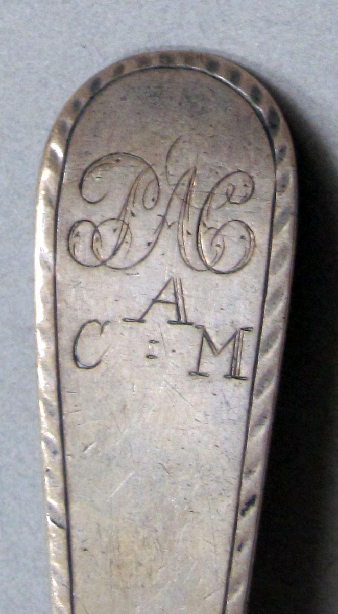 1962.0240.1262 Silver spoon engraving