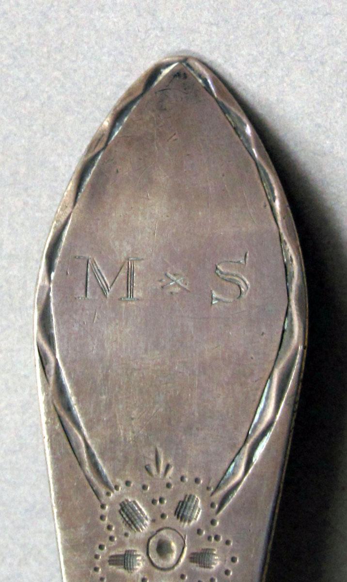 1962.0240.1266 Silver spoon engraving
