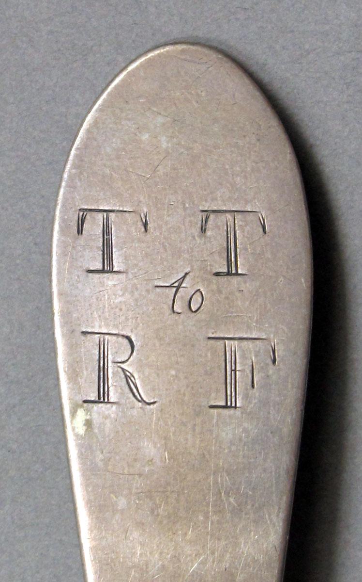 1962.0240.1268 Silver spoon engraving