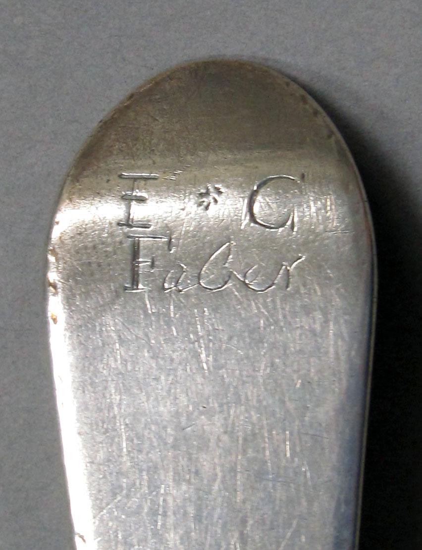 1962.0240.1283 Silver spoon engraving