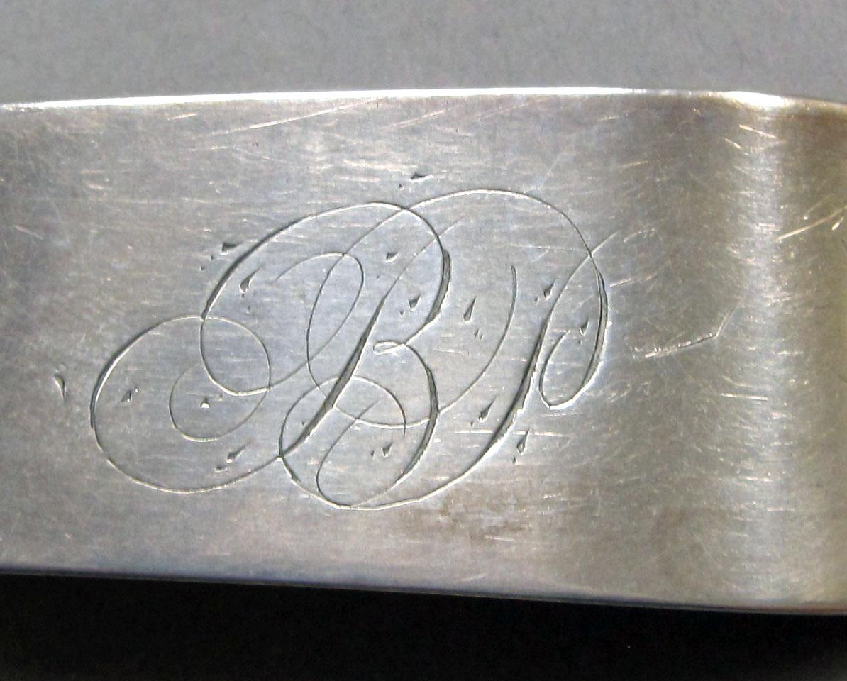 1962.0240.1284 Silver spoon engraving