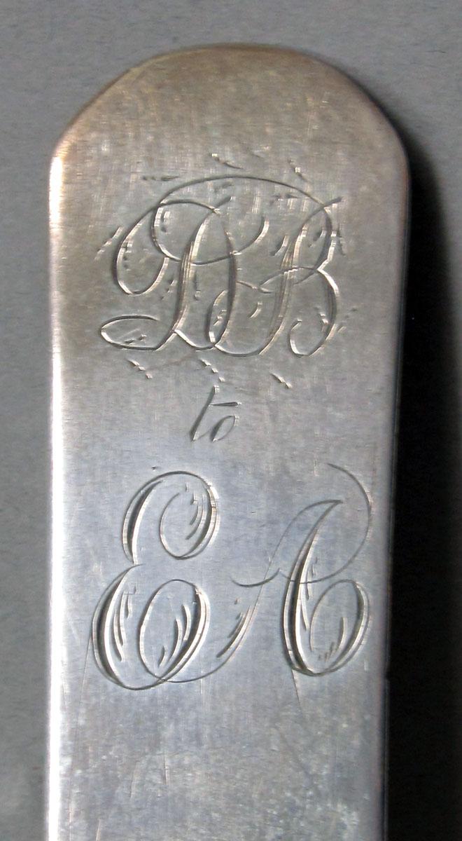 1962.0240.1286 Silver spoon engraving