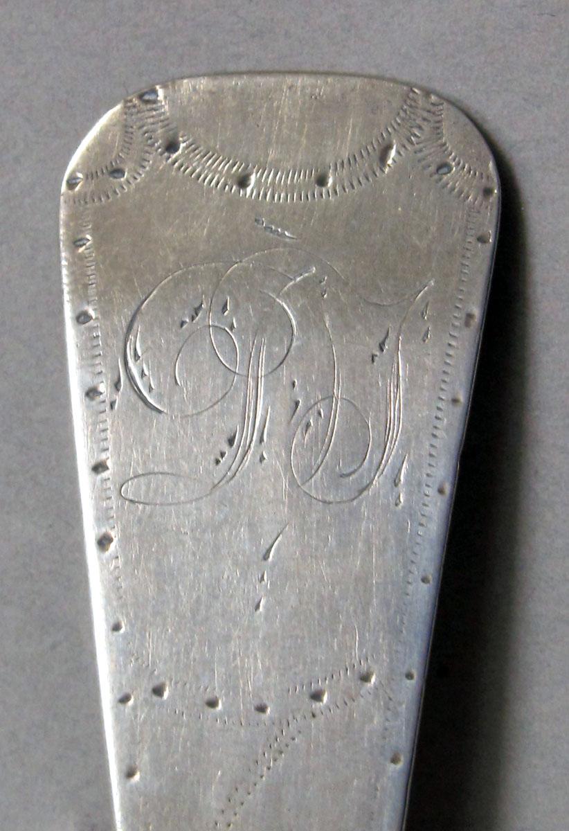 1962.0240.1290 Silver spoon engraving
