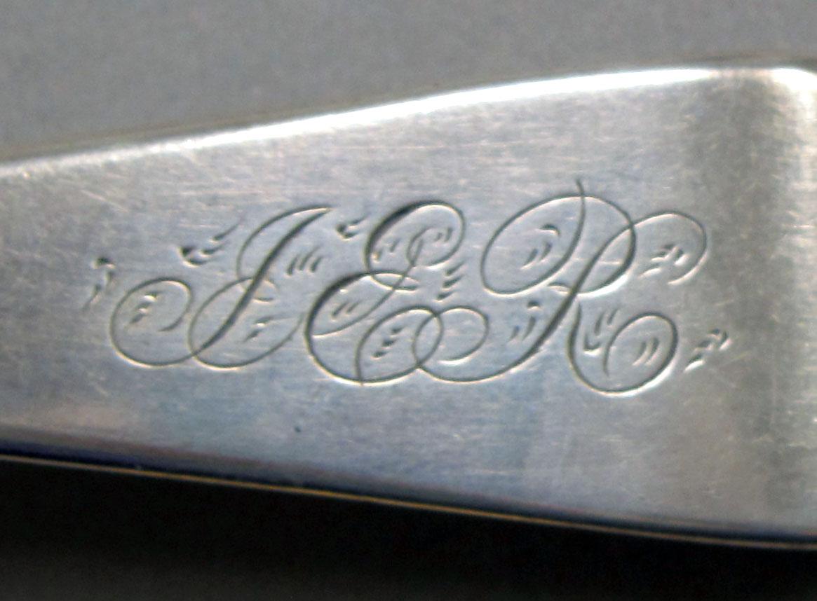 1962.0240.1291 Silver spoon engraving
