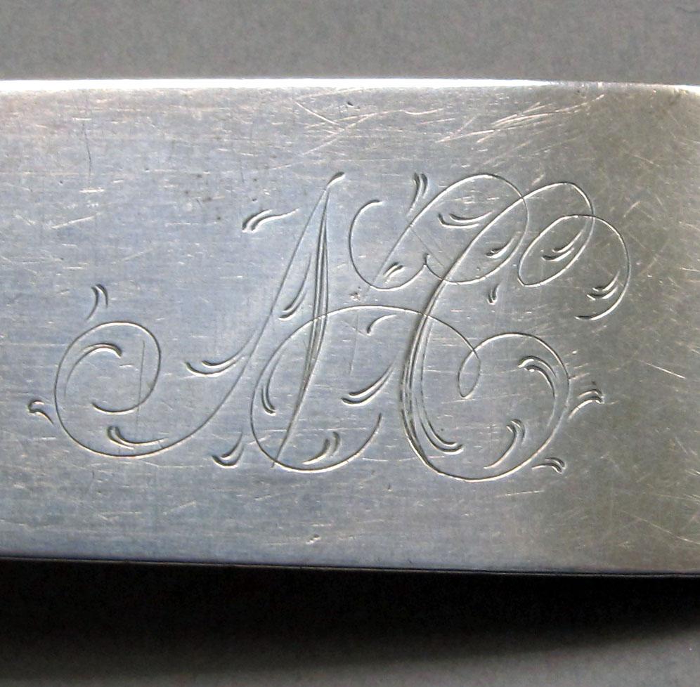 1962.0240.1292 Silver spoon engraving