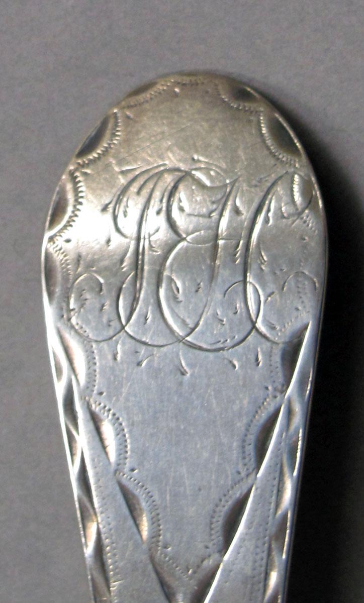 1962.0240.1298 Silver spoon engraving