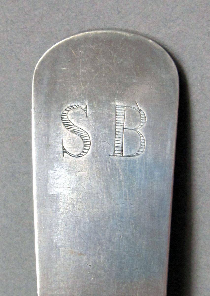 1962.0240.1310 Silver spoon engraving