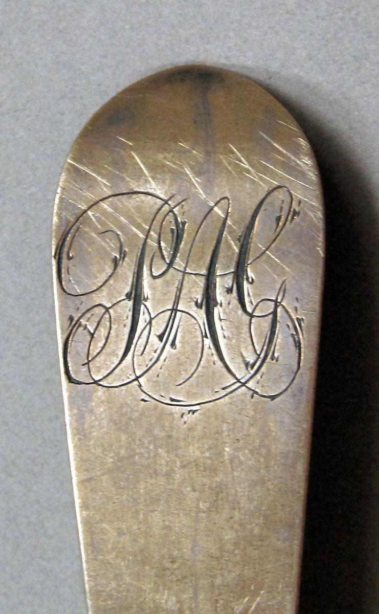 1962.0240.1314 Silver spoon engraving