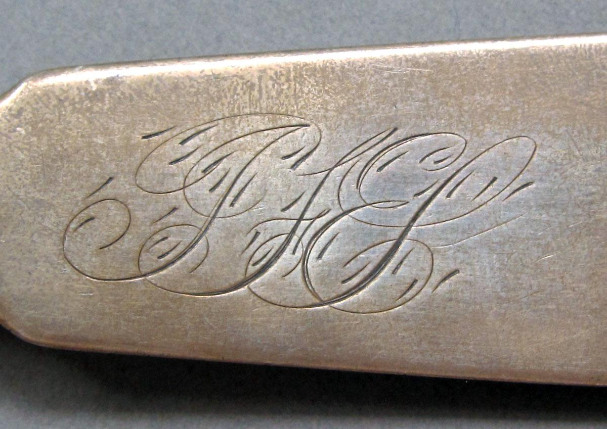 1962.0240.1315 Silver spoon engraving