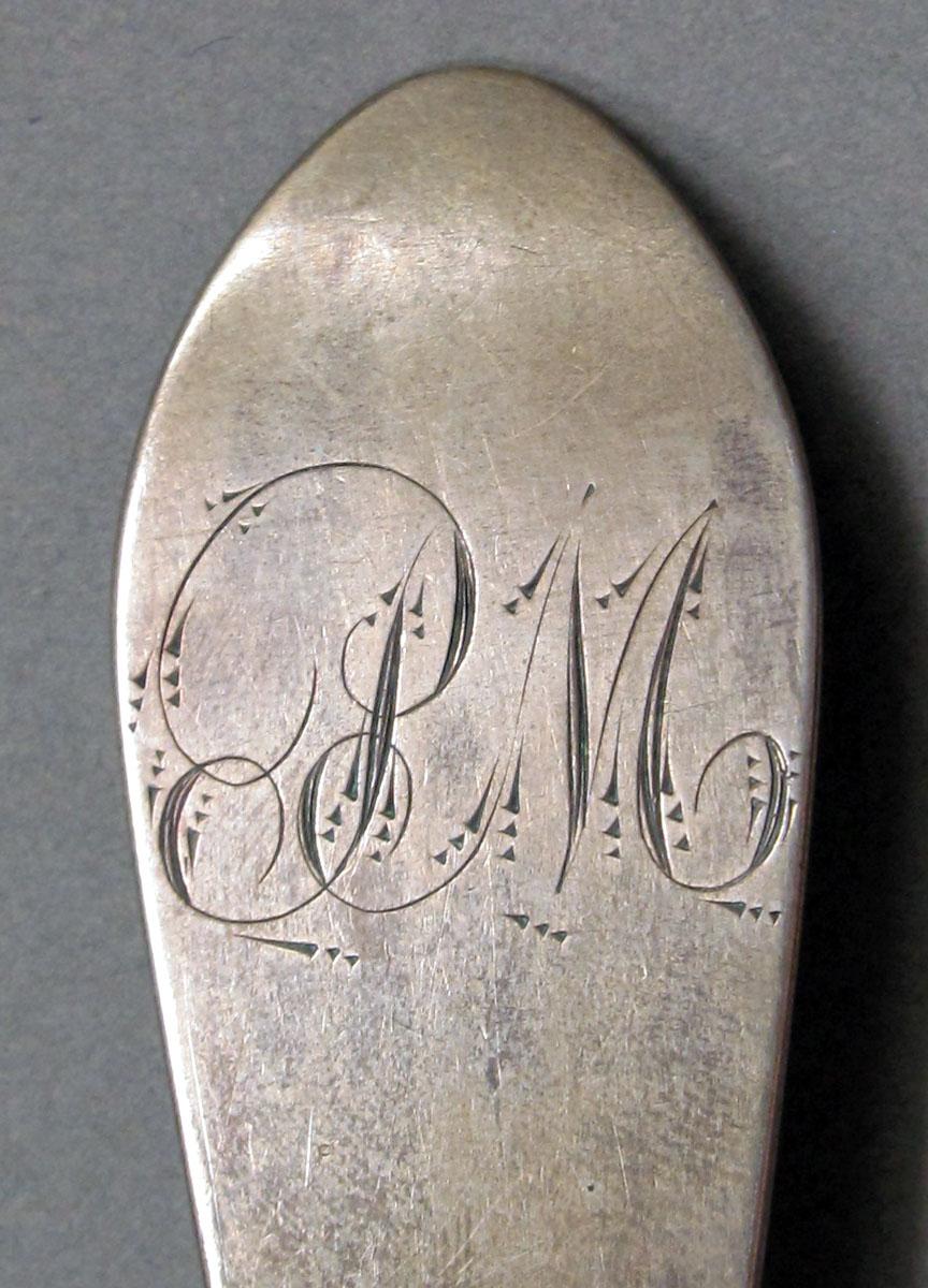 1962.0240.1316 Silver spoon engraving