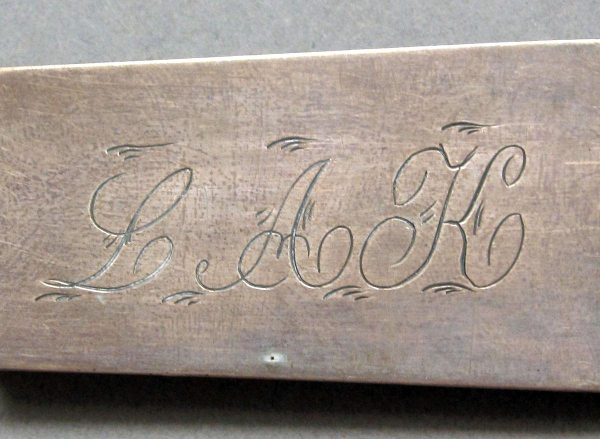 1962.0240.1318 Silver spoon engraving