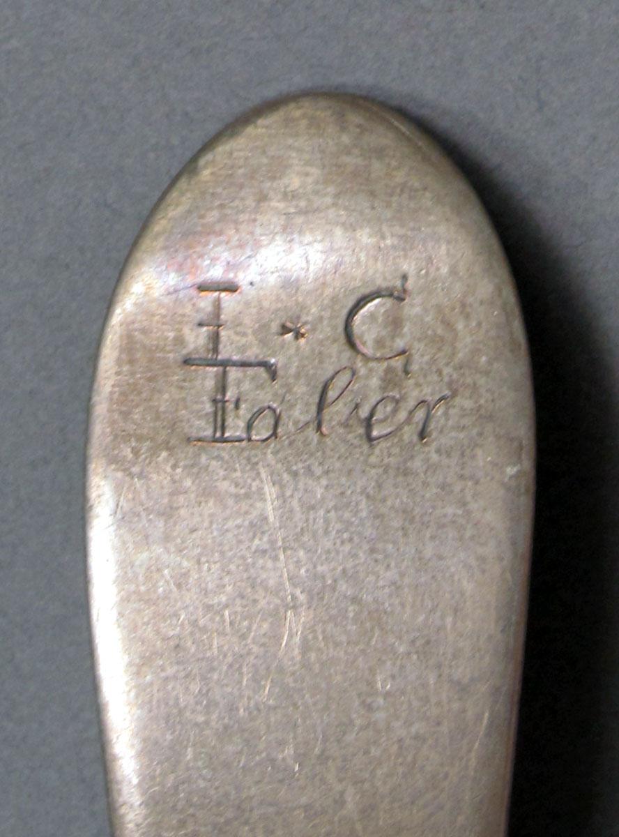 1962.0240.1322 Silver spoon engraving