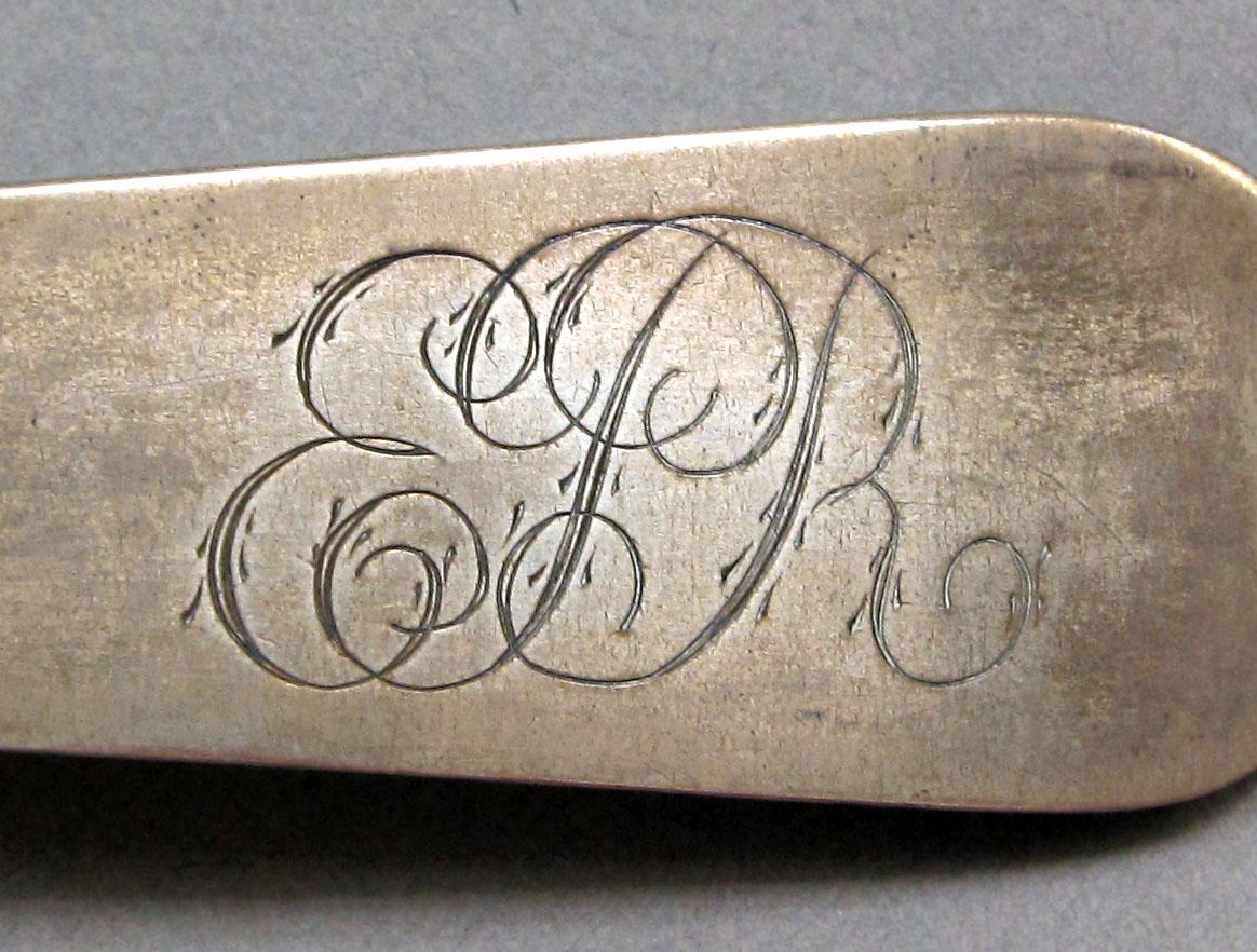 1962.0240.1325 Silver spoon engraving