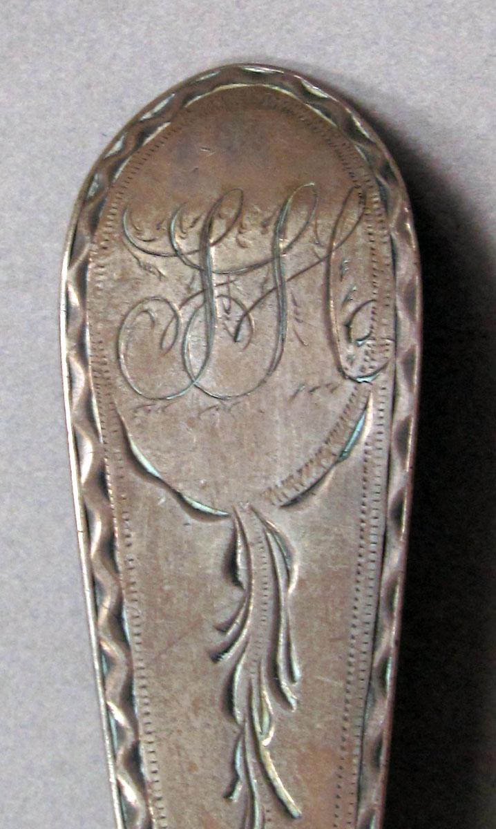 1962.0240.1326 Silver spoon engraving