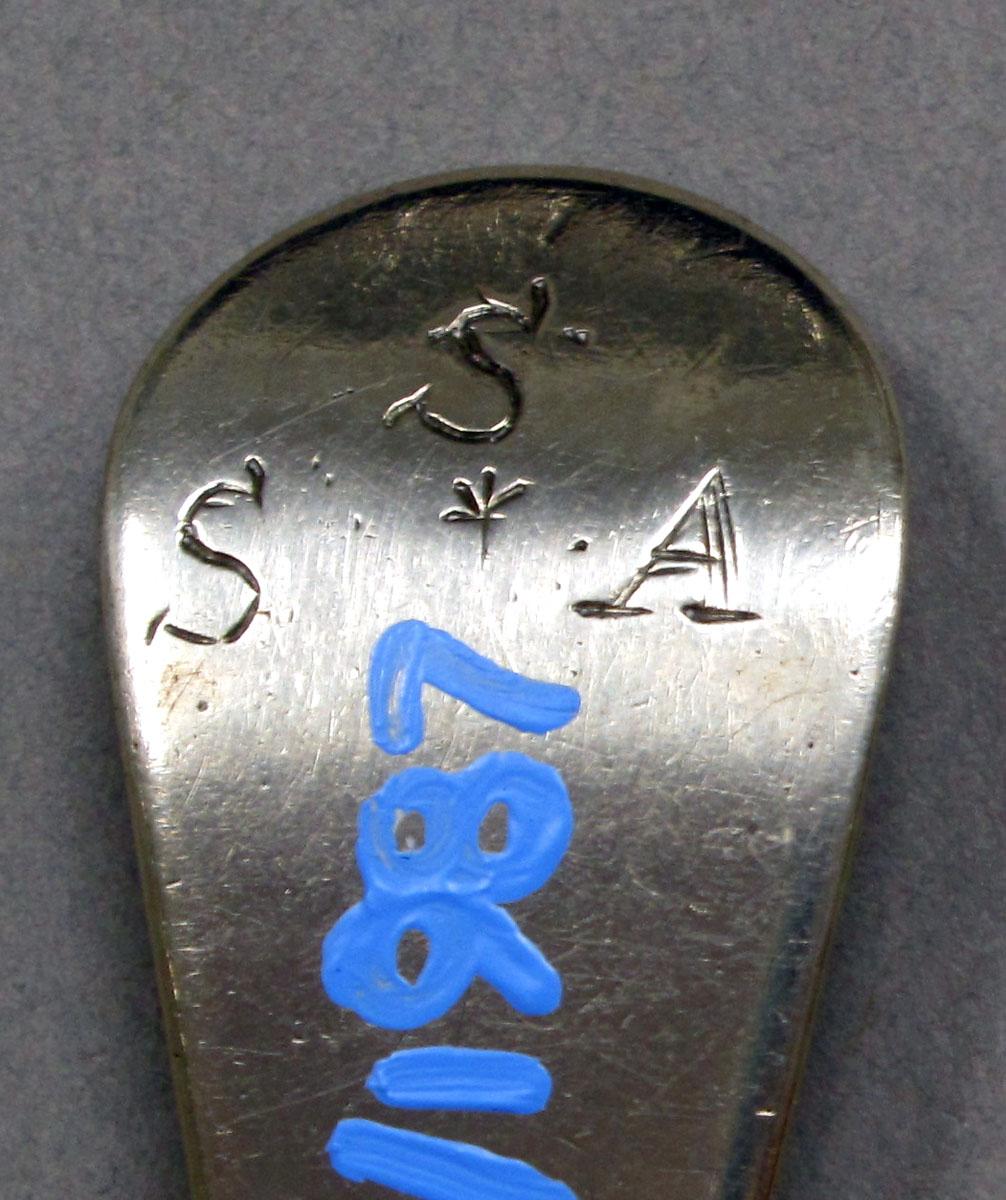 1962.0240.1328 Silver spoon engraving