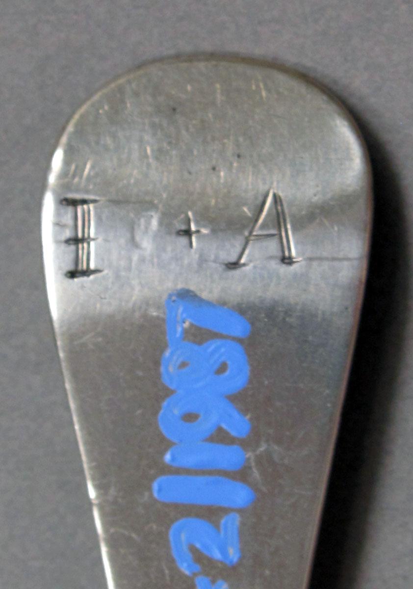 1962.0240.1329 Silver spoon engraving