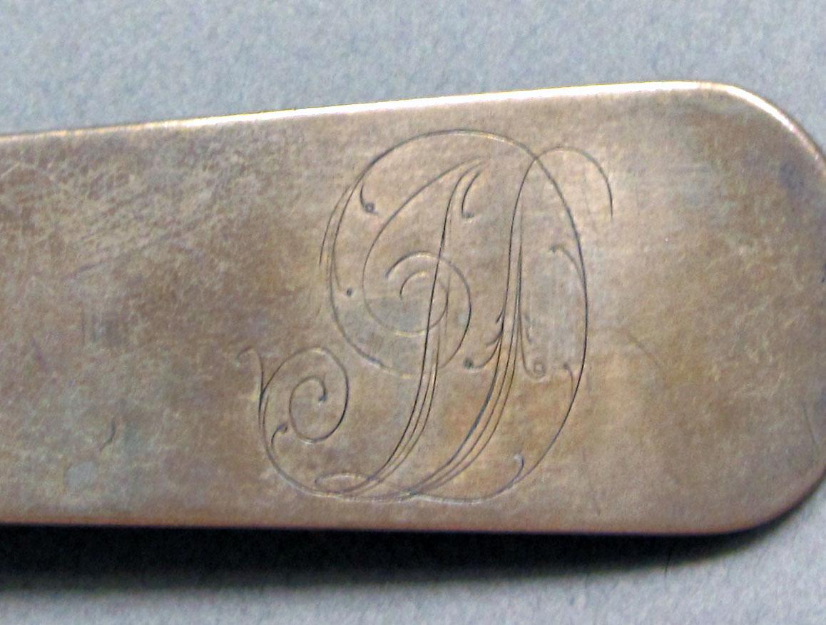 1962.0240.1330 Silver spoon engraving
