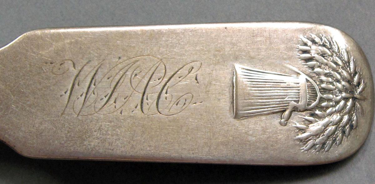 1962.0240.1333 Silver spoon engraving