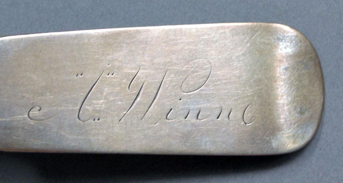 1962.0240.1335 Silver spoon engraving