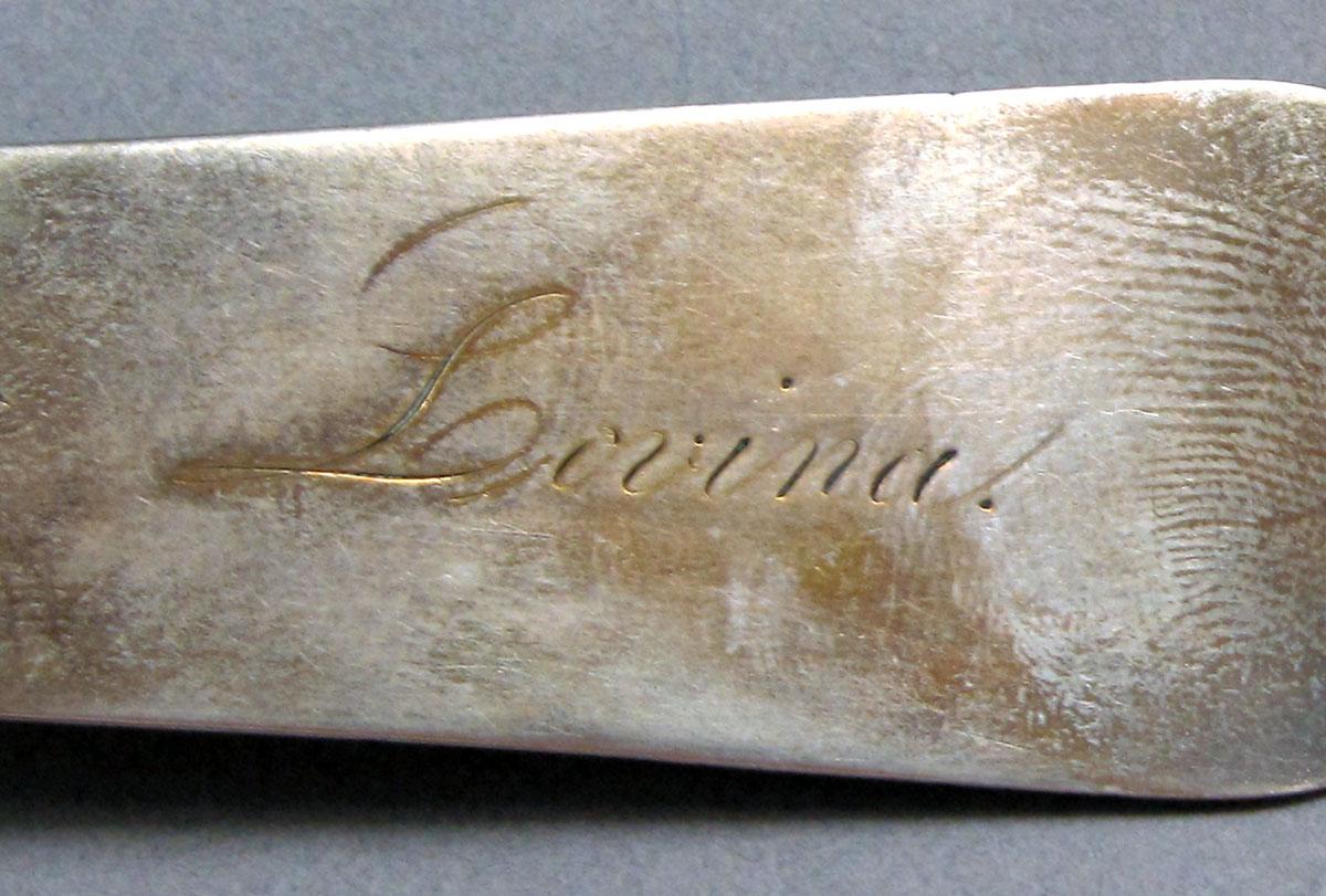 1962.0240.1336 Silver spoon engraving