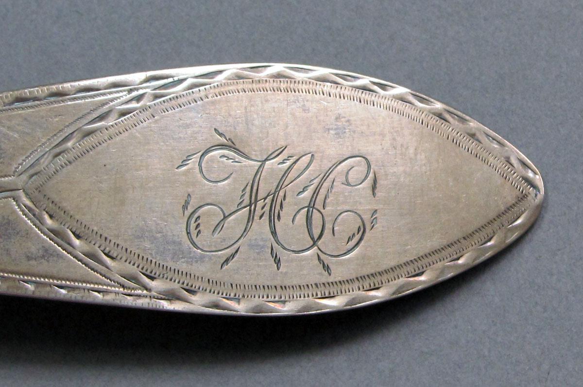 1962.0240.1338 Silver spoon engraving