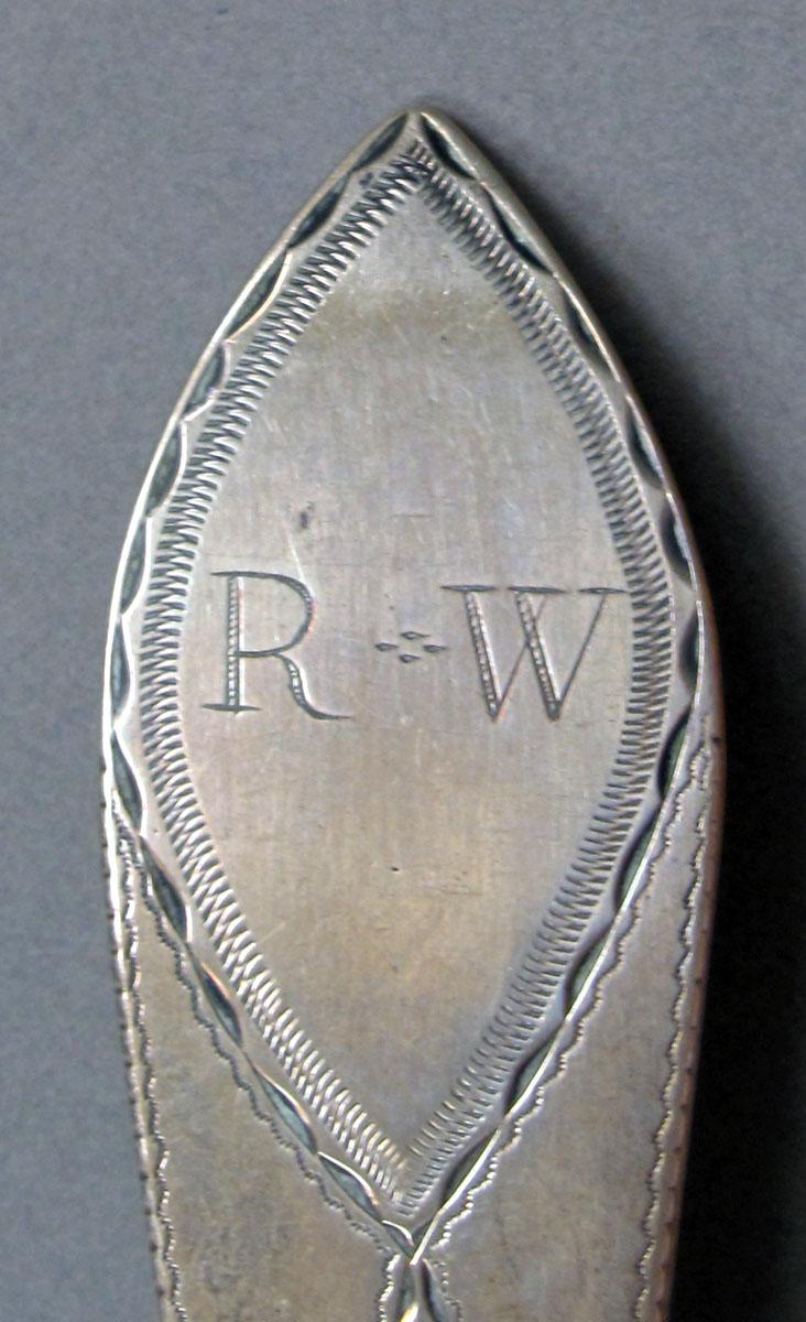 1962.0240.1340 Silver spoon engraving