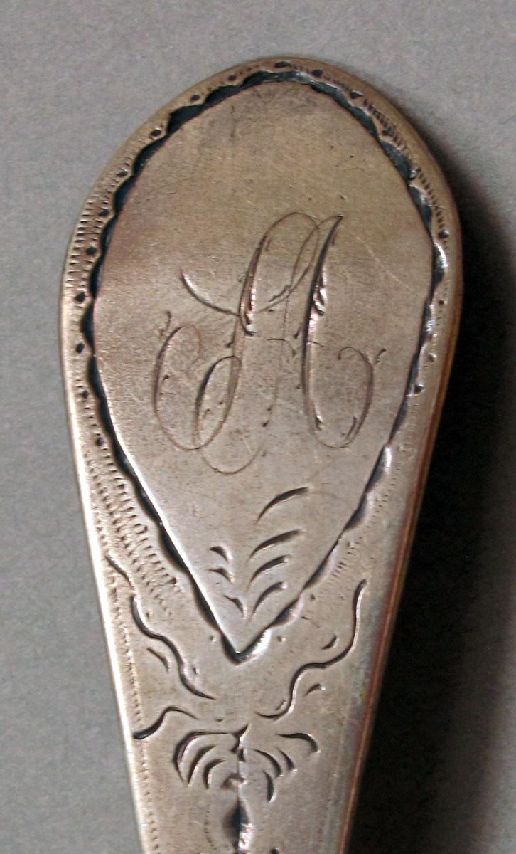 1962.0240.1342 Silver spoon engraving