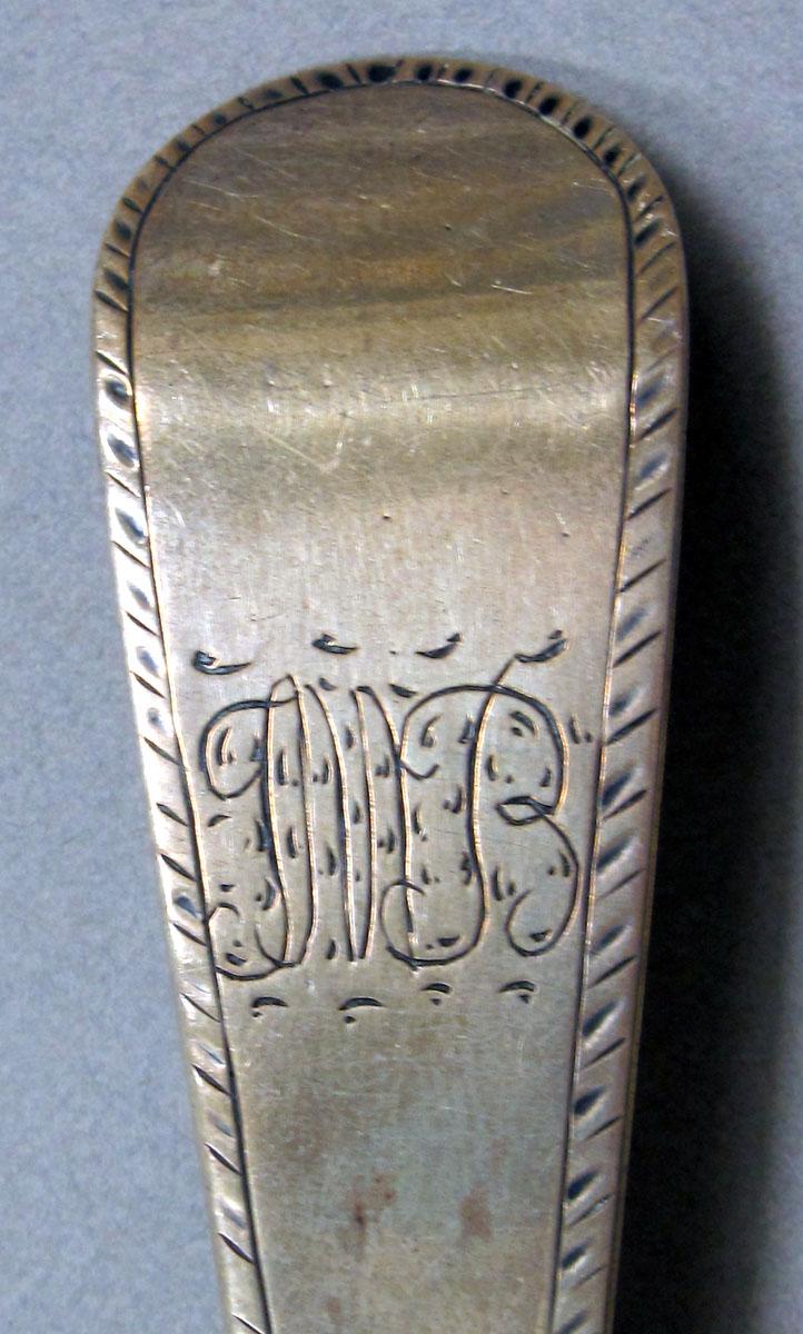 1962.0240.1345 Silver spoon engraving