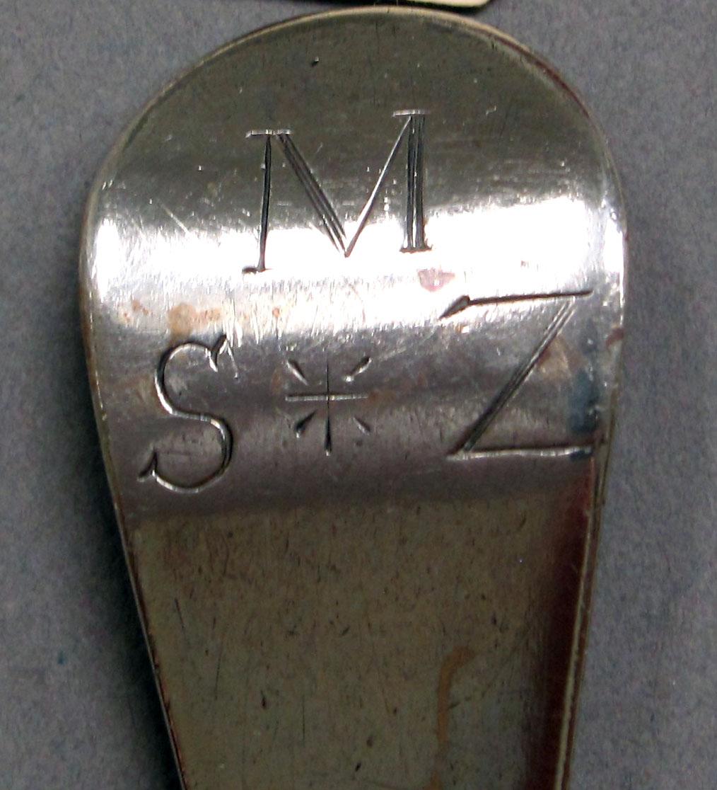 1962.0240.1357 Silver spoon engraving