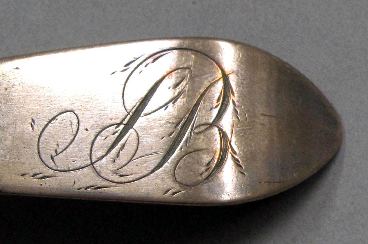 1962.0240.1373 Silver spoon engraving