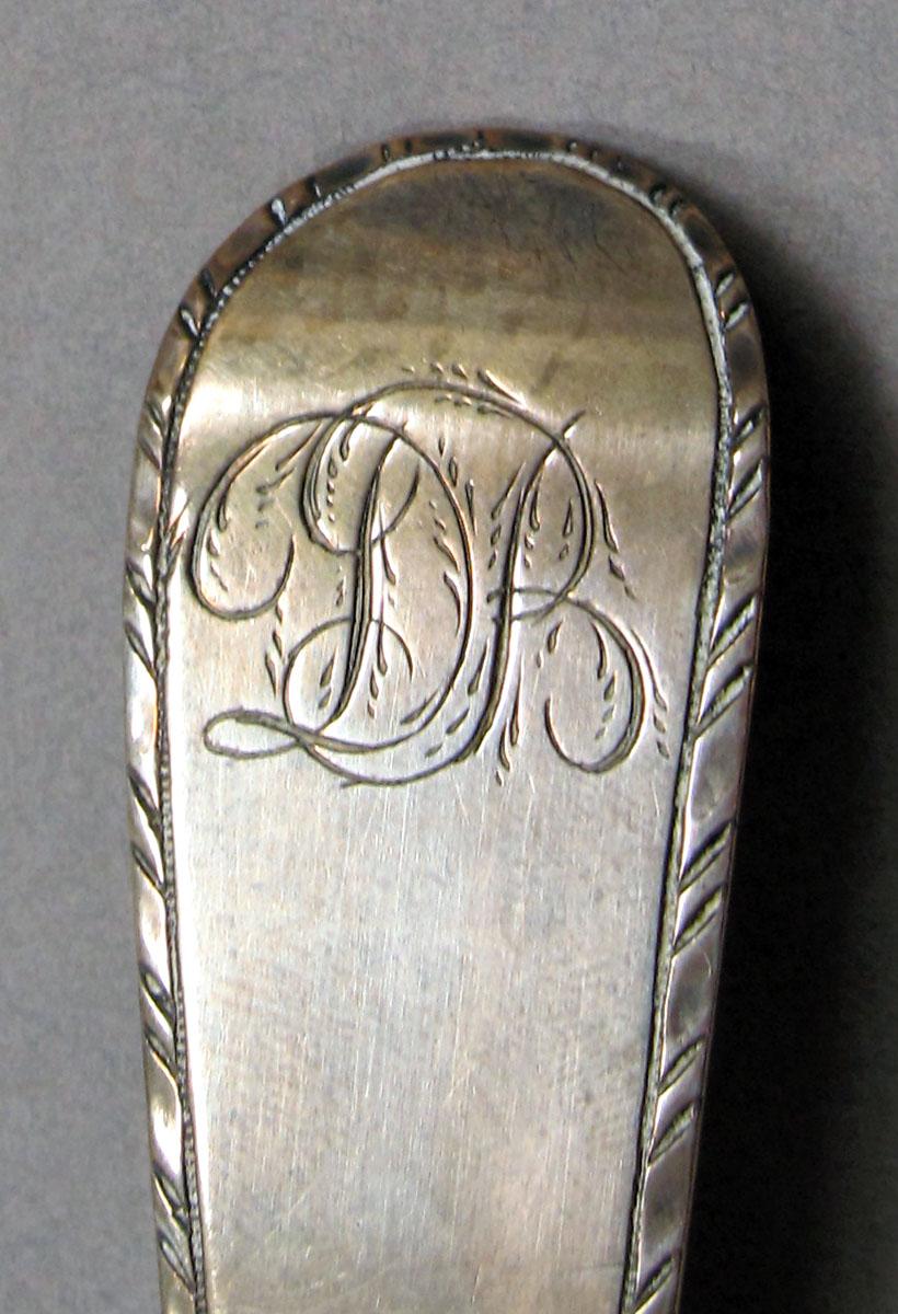1962.0240.1388 Silver spoon engraving