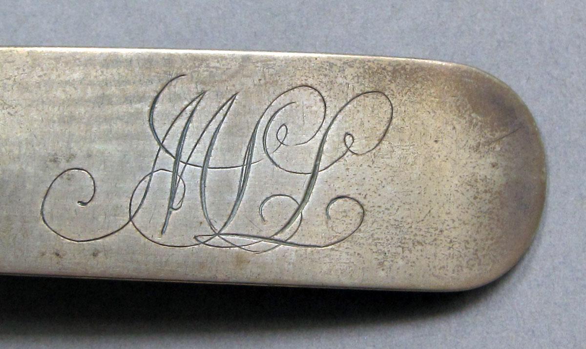 1962.0240.1397 Silver spoon engraving