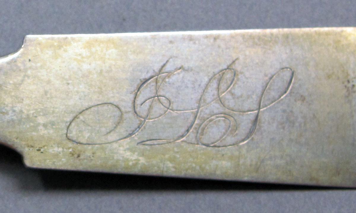 1962.0240.1411 Silver spoon engraving