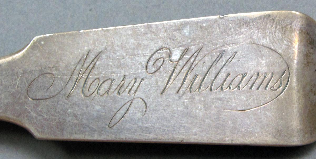 1962.0240.1412 Silver spoon engraving