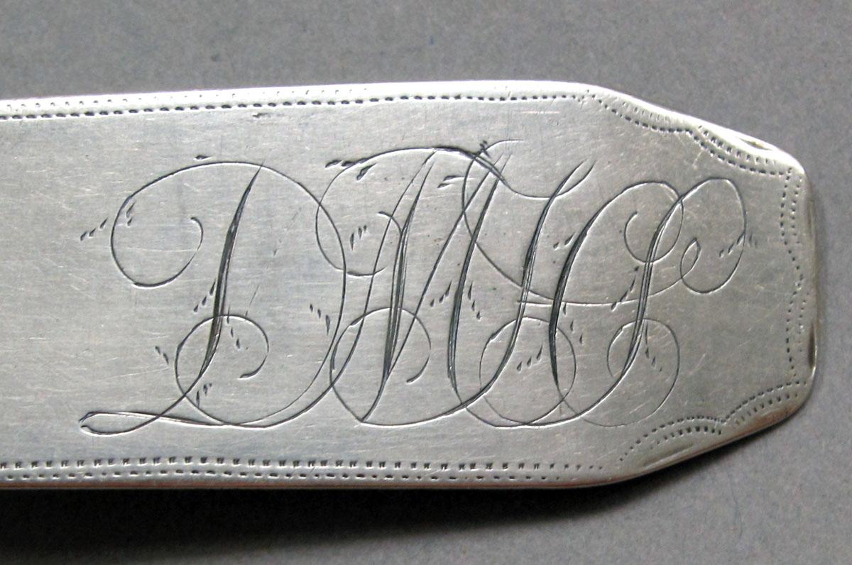 1962.0240.1414 Silver spoon engraving