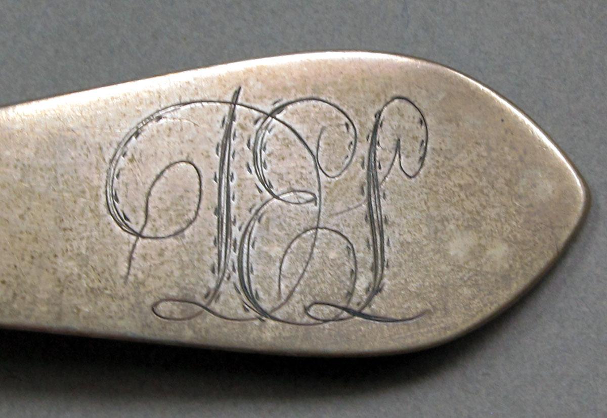 1962.0240.1425 Silver spoon engraving