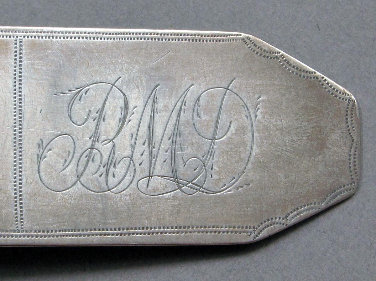 1962.0240.1428 Silver spoon engraving