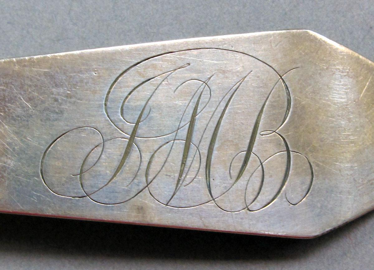 1962.0240.1430 Silver spoon engraving