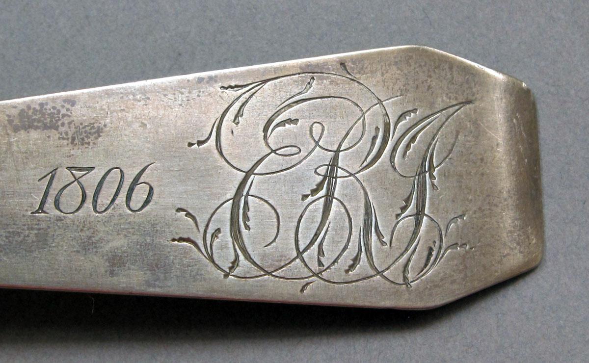 1962.0240.1434 Silver spoon engraving