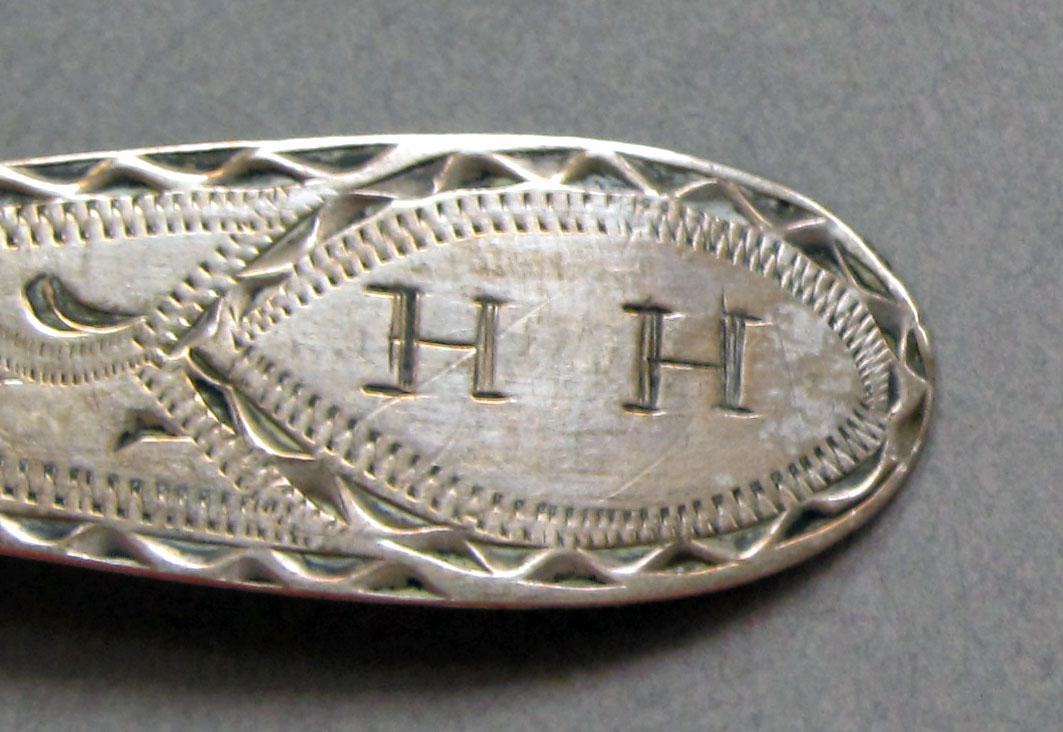 1962.0240.1437 Silver spoon engraving