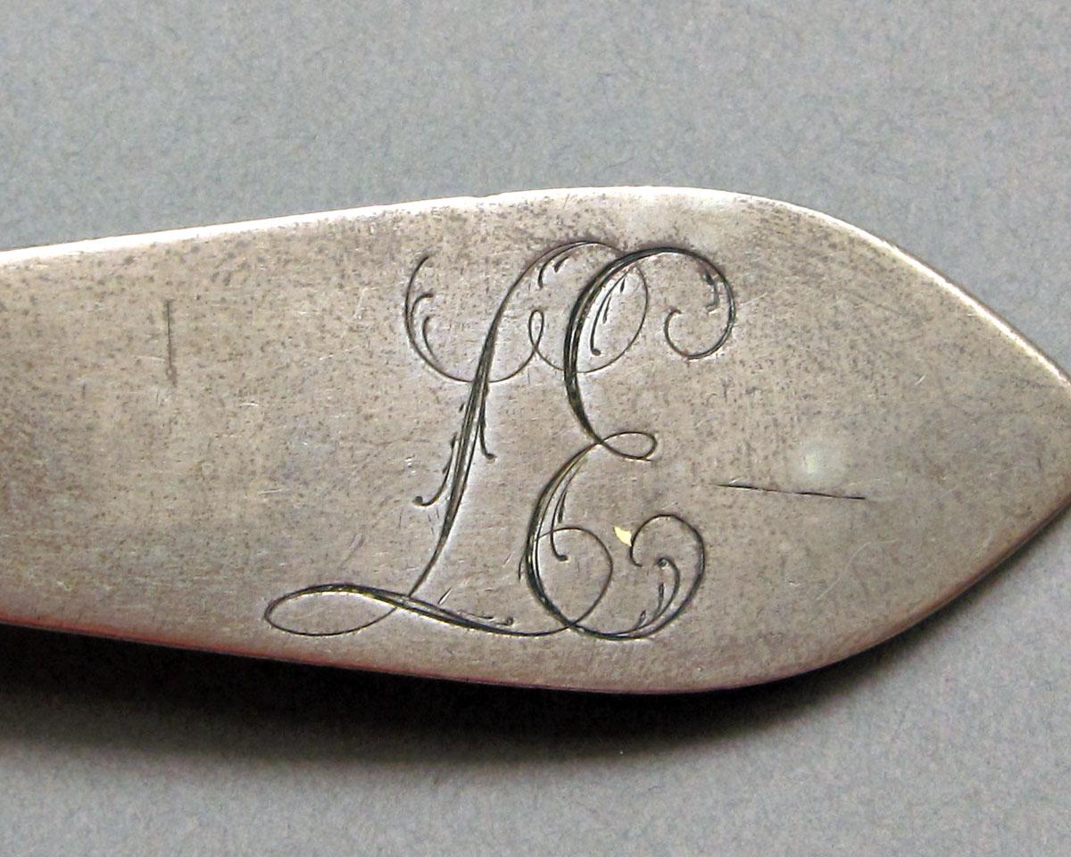 1962.0240.1456 Silver spoon engraving